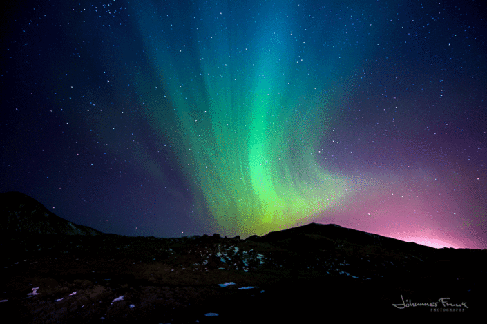 Northern Lights shining over Bláfjöll Bluemountains in Iceland